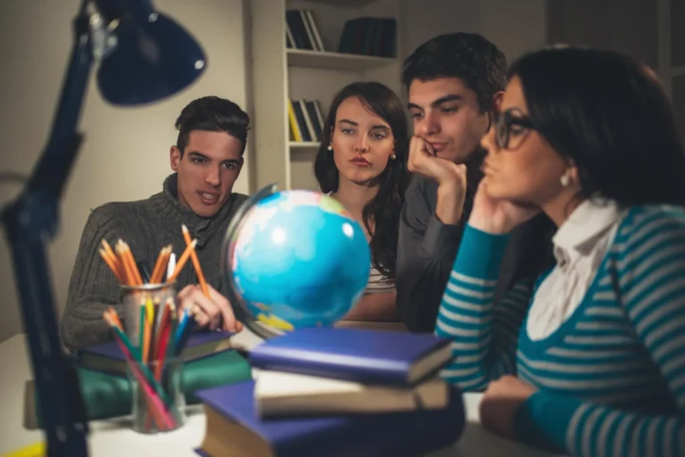 four-beautiful-students-geography-learning-with-globe-thinking-vintage-concept